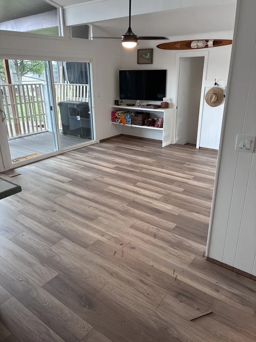 Wide-plank wood-look LVP flooring installed in an open living room in San Antonio, TX