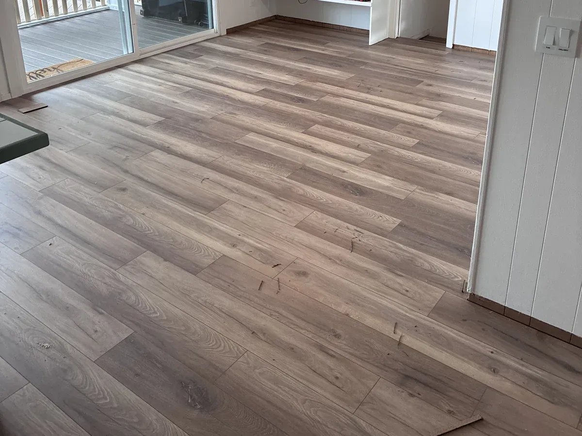 Wide-plank wood-look LVP flooring installed in a remodeled living room